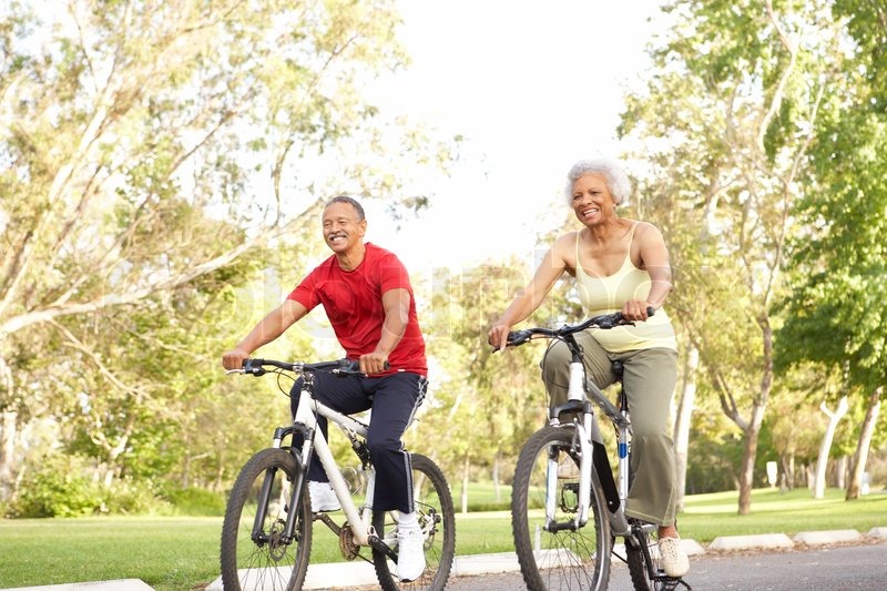 senior-couple-riding-bikes-in-park